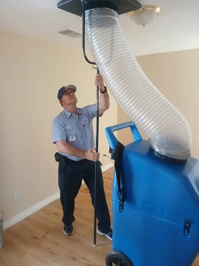 Furnace Tune-Up technician using HEPA equipment in Zephyrhills South